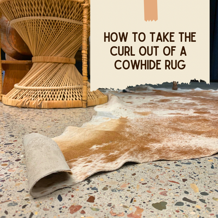 How do I take the curl out of my cowhide rug?