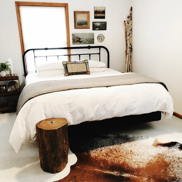 Cowhide Rug in a bedroom