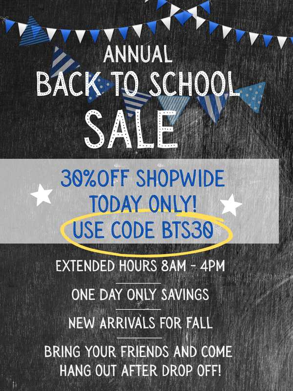 A promotional flyer for an annual back to school sale with a dark chalkboard background, blue and white bunting, and text offering 30% off shopwide with the code BTS30 circled in yellow.