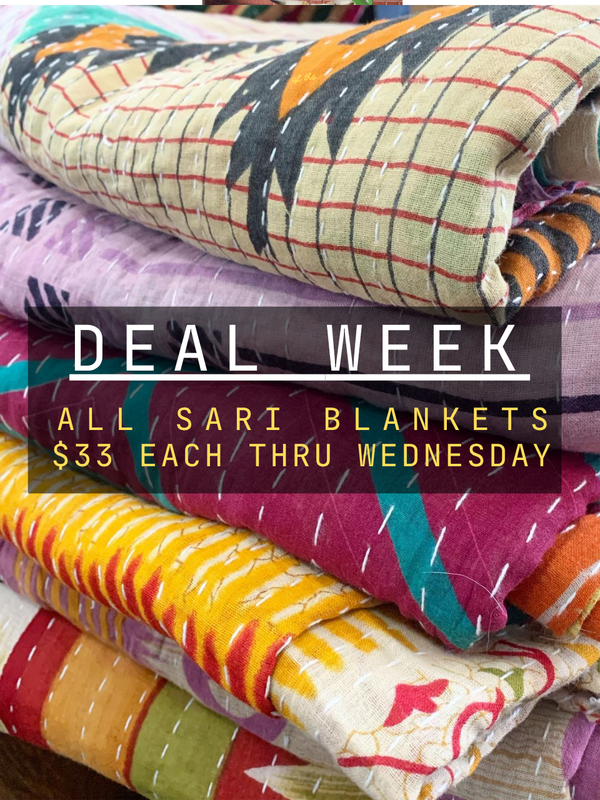 Stack of colorful saree blankets with promotional text overlay