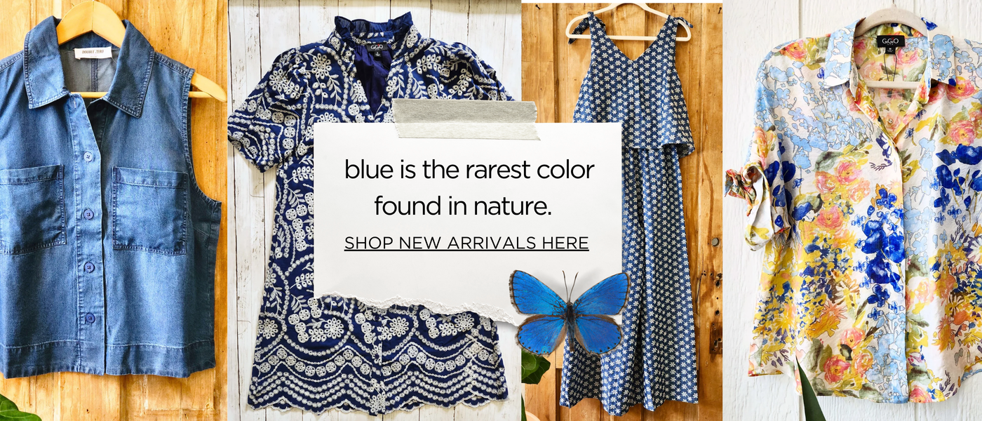 A collage of four different clothing items displayed on wooden hangers against a rustic wood panel background. The items include a blue denim vest, a blue and white patterned short-sleeve shirt, a blue and white patterned maxi dress, and a multicolor floral button-down shirt.